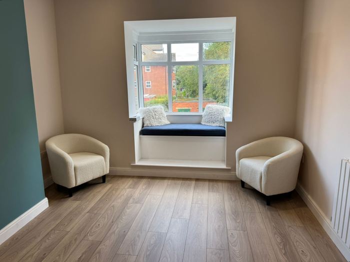 Therapy room with a bay window seat